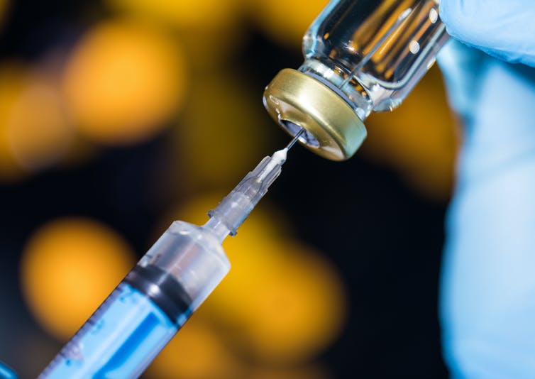 vaccine needle and bottle