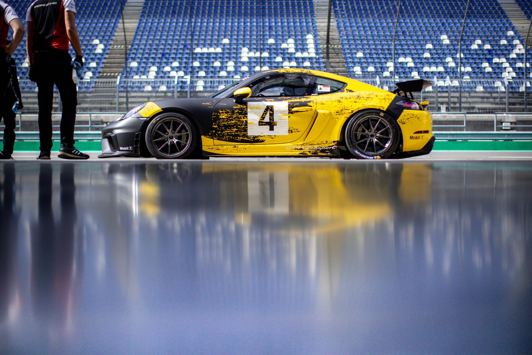 image of the Swiss Racer in yellow and black with the number 4 on the side