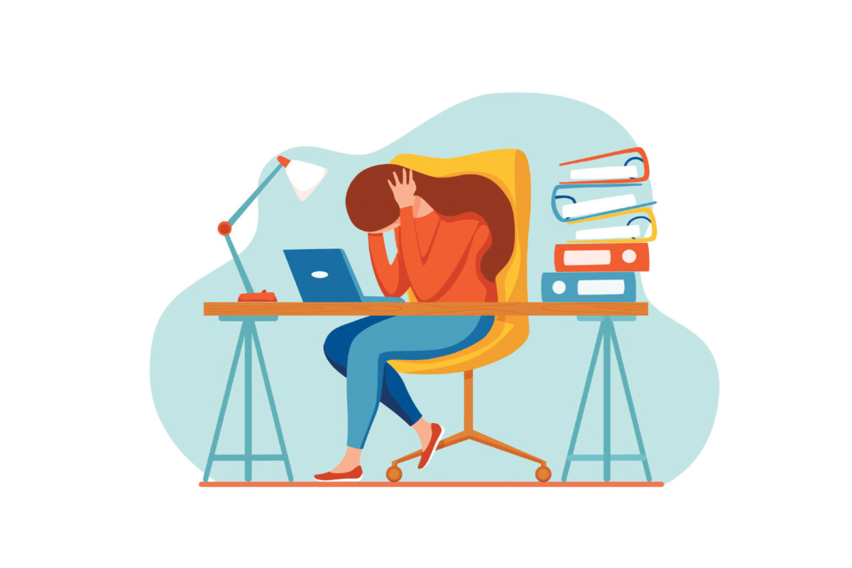 cartoon of a girl sitting at a desk displaying signs of anxiety