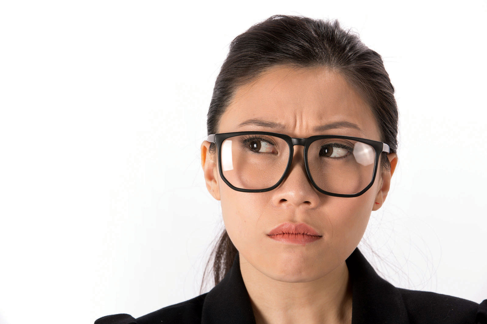woman looking perplexed in glasses