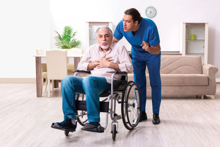 Caregiver yelling at an elderly man in a wheelchair