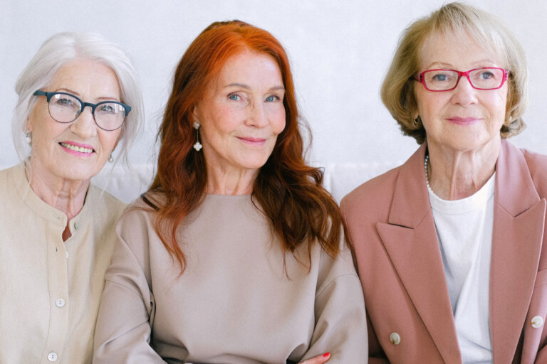 Three woman smiling at the camera